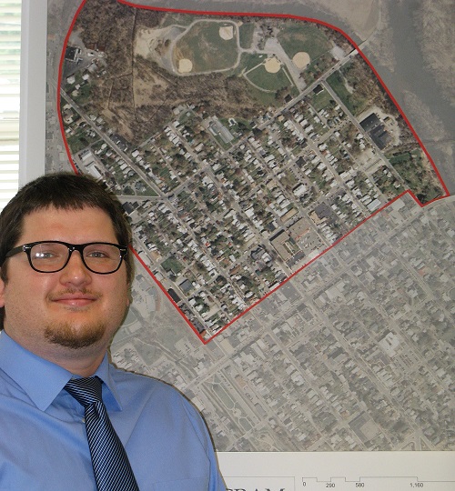 Jesse Lewis in the LNC office with the map of the North Ward Neighborhood